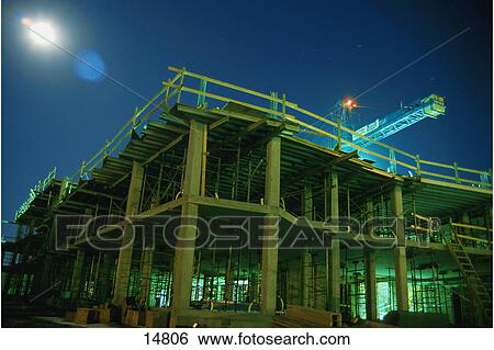 Building under construction at night View Large Photo Image Stock Photograph - Building under construction at night. Fotosearch