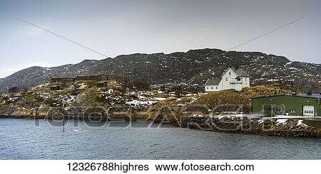Buildings on the rugged landscape along the ocean; Nordland, Norway View Large Photo Image Stock Photograph - Buildings on the rugged landscape along the ocean; Nordland, Norway. Fotosearch