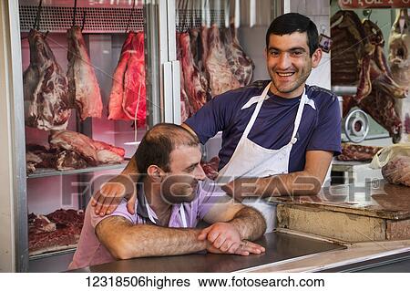 Stock Photograph - Butchers at the Shuka 0. 2 food market; Yerevan, Armenia. Fotosearch