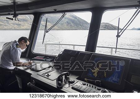 Captain on bridge of cruise ship in Tierra del Fuego, Patagonia; Chile View Large Photo Image Stock Photograph - Captain on bridge of cruise ship in Tierra del Fuego, Patagonia; Chile. Fotosearch
