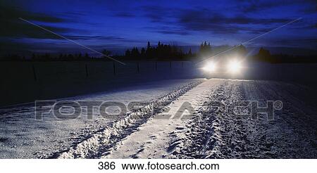 Stock Photograph - Car tracks and car in snow. Fotosearch
