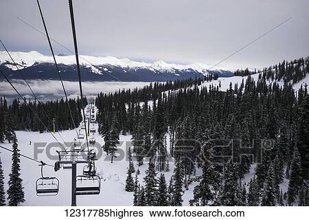Chair lift at a ski resort, Banff National Park; Banff, Alberta, Canada View Large Photo Image Stock Photograph - Chair lift at a ski resort, Banff National Park; Banff, Alberta, Canada. Fotosearch
