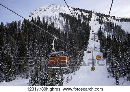 Chair lift at Sunshine Village ski resort, Banff National Park; Banff, Alberta, Canada View Large Photo Image Stock Photograph - Chair lift at Sunshine Village ski resort, Banff National Park; Banff, Alberta, Canada. Fotosearch