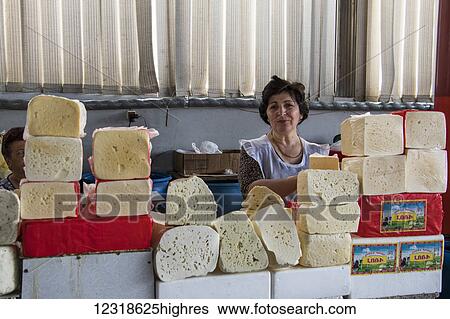 Stock Photograph - Cheese vendor at the Shuka 0. 2 Food Market; Yerevan, Armenia. Fotosearch