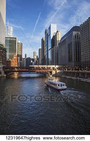 Stock Photograph - Chicago Transit Authority train crossing the 0rth Wells Street bridge over the Chicago River; Chicago, Illi0is, United States of America. Fotosearch