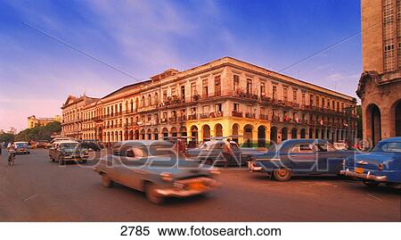 Classic cars driving around View Large Photo Image Stock Photography - Classic cars driving around. Fotosearch