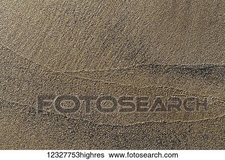 Stock Photograph - Close-up detail of a surface of sand; South Shields, Tyne and Wear, Englnd. Fotosearch