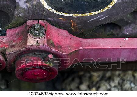 Close-up of a red metal mechanism; Yorkshire, England View Large Photo Image Stock Photograph - Close-up of a red metal mechanism; Yorkshire, England. Fotosearch