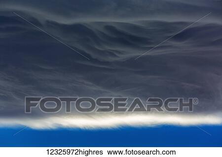 Close-up of chinook cloud formation with blue sky ending the clouds; Calgary, Alberta, Canada View Large Photo Image Stock Photograph - Close-up of chinook cloud formation with blue sky ending the clouds; Calgary, Alberta, Canada. Fotosearch
