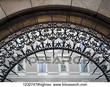 Close-up of the ornate design on an archway with a building in the background; Stockholm, Sweden View Large Photo Image Stock Photograph - Close-up of the ornate design on an archway with a building in the background; Stockholm, Sweden. Fotosearch