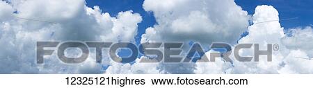 Stock Photograph - Clouds in a blue sky; Alberta, Canada. Fotosearch