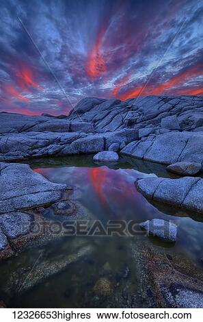 Coastal rock pool and flaming clouds at sunset near Prospect; Nova Scotia, Canada View Large Photo Image Stock Photograph - Coastal rock pool and flaming clouds at sunset near Prospect; Nova Scotia, Canada. Fotosearch