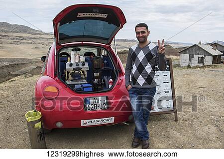 Stock Photograph - Coffee vendor selling coffee from a car, David Gareja; Kakheti, Georgia. Fotosearch