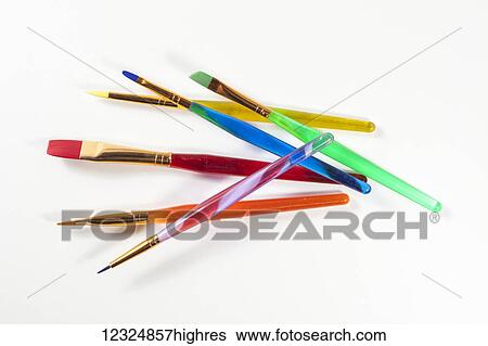 Coloured paint brushes on a white background; Ontario, Canada View Large Photo Image Stock Photograph - Coloured paint brushes on a white background; Ontario, Canada. Fotosearch