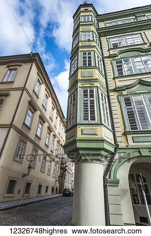 Colourful facade of the corner of a residential building along a cobblestone street; Prague, Czechia View Large Photo Image Stock Photograph - Colourful facade of the corner of a residential building along a cobblestone street; Prague, Czechia. Fotosearch