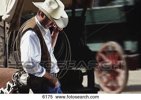 Cowboy with lasso over his shoulder View Large Photo Image Stock Photography - Cowboy with lasso over his shoulder. Fotosearch
