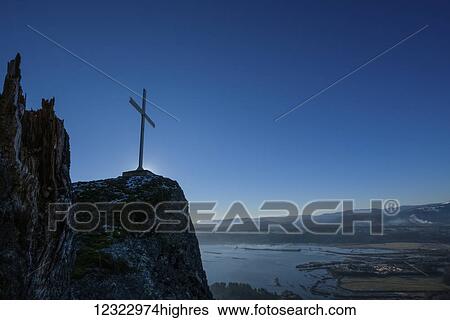Stock Photograph - Cross on Mount Tzouhalem, Cowichan Bay, on a winter day; British Columbia, Canada. Fotosearch