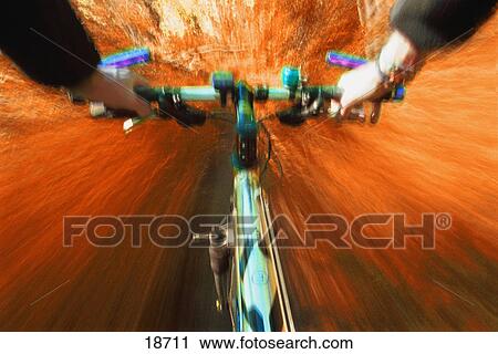 Stock Image - Cyclist's view of trail bike. Fotosearch