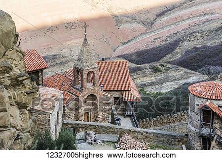 Stock Photograph - David Gareja monastery complex (the 6th century rock-hewn Georgian Orthodox monastery with hundreds of cave cells, churches, chapels, refectories and living quarters); Kakheti, Georgia. Fotosearch