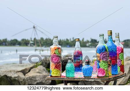 Decorated glass bottles with colorful roses; Kochi, Ernakulam district, Kerala, India View Large Photo Image Stock Photograph - Decorated glass bottles with colorful roses; Kochi, Ernakulam district, Kerala, India. Fotosearch