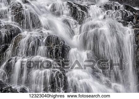 Stock Photograph - Detail of unnamed waterfall in Barry Arm near Cascade Glacier, Prince William Sound, South-central Alaska; Alaska, United States of America. Fotosearch