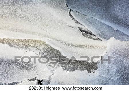 Stock Photograph - Detail view of frozen overflow ice on top sea ice along Turnagain Arm in winter, South-central Alaska; Anchorage, Alaska, United States of America. Fotosearch