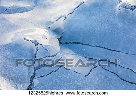 Stock Photograph - Detail view of frozen overflow on sea ice along Turnagain Arm in winter, South-central Alaska; Alaska, United States of America. Fotosearch