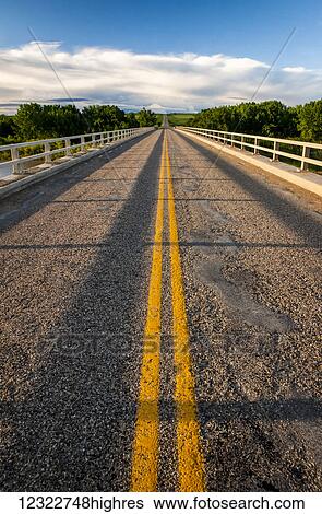 Double solid yellow line down a paved road; Herschel, Saskatchewan, Canada View Large Photo Image Stock Photograph - Double solid yellow line down a paved road; Herschel, Saskatchewan, Canada. Fotosearch