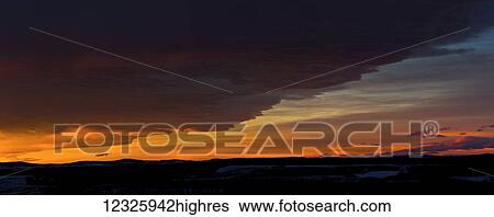 Dramatically glowing Chinook cloud formation at sunrise; Calgary, Alberta, Canada View Large Photo Image Stock Photograph - Dramatically glowing Chinook cloud formation at sunrise; Calgary, Alberta, Canada. Fotosearch