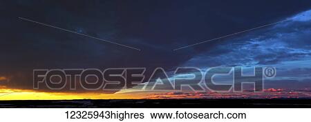 Dramatically glowing Chinook cloud formation at sunrise; Calgary, Alberta, Canada View Large Photo Image Stock Photograph - Dramatically glowing Chinook cloud formation at sunrise; Calgary, Alberta, Canada. Fotosearch