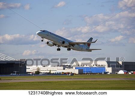Stock Photograph - Embraer 190; Montreal, Quebec, Canada. Fotosearch