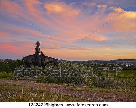 Stock Photograph - Equestrian statue in Cochrane Ranch Park; Cochrane, Alberta, Canada. Fotosearch