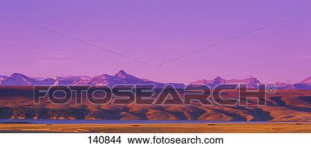 Farmer's field with river and mountains in background View Large Photo Image Picture - Farmer's field with river and mountains in background. Fotosearch
