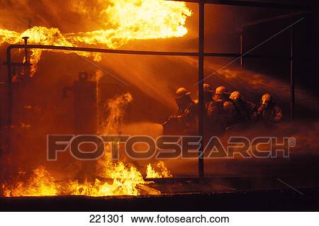 Stock Image - Firemen fighting fire. Fotosearch
