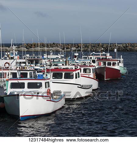Fishing boats moored in a harbour; Main-a-dieu, 0va Scotia, Canada View Large Photo Image Stock Photograph - Fishing boats moored in a harbour; Main-a-dieu, 0va Scotia, Canada. Fotosearch