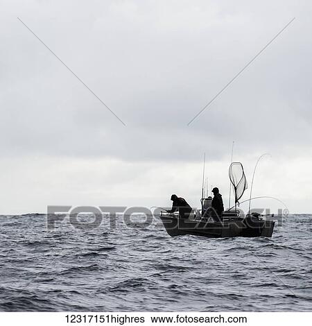 Stock Photograph - Fishing from a fishing boat off the Queen Charlotte Islands; British Columbia, Canada. Fotosearch
