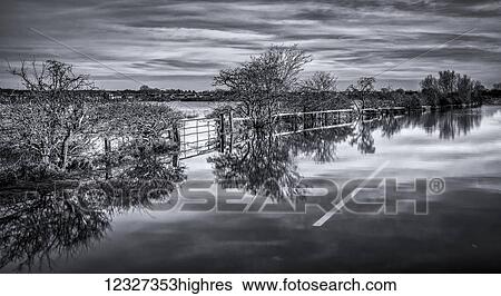 Flooded roads and field in black and white; South Tyneside, Tyne and Wear, England View Large Photo Image Stock Photograph - Flooded roads and field in black and white; South Tyneside, Tyne and Wear, England. Fotosearch