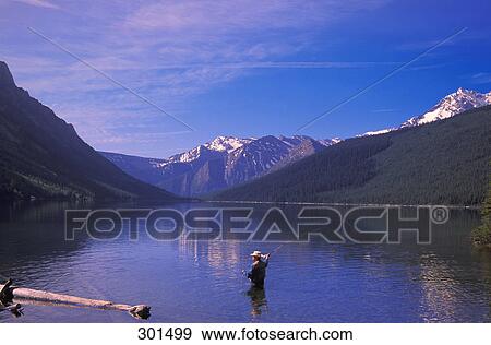 Stock Photo - Fly Fishing Coners lake Height of the Rockies Provincial park British Columbia Canada. Fotosearch