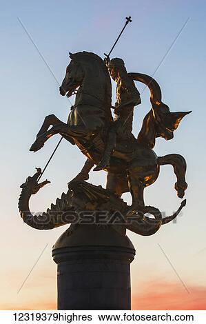 Stock Photograph - Freedom Monument, commonly known as the St. George Statue, located on Freedom Square, at dawn; Tbilisi, Georgia. Fotosearch