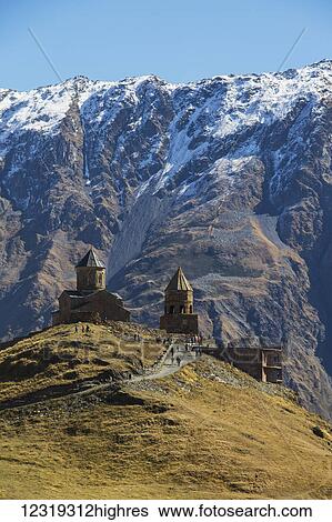 Gergeti Trinity Church with the Caucasus Mountains in the background; Kazbegi, Mtskheta-Mtianeti, Georgia View Large Photo Image Stock Photograph - Gergeti Trinity Church with the Caucasus Mountains in the background; Kazbegi, Mtskheta-Mtianeti, Georgia. Fotosearch