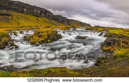 Stock Photograph - Glacial river along the road on the south coast of Iceland; Iceland. Fotosearch