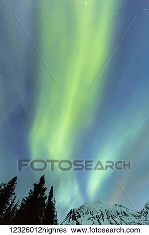 Green Aurora Borealis dances over the Kenai Mountains, Moose Pass, Kenai Peninsula, South-central Alaska; Alaska, United States of America View Large Photo Image Stock Photograph - Green Aurora Borealis dances over the Kenai Mountains, Moose Pass, Kenai Peninsula, South-central Alaska; Alaska, United States of America. Fotosearch