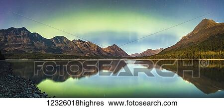 Green Aurora Borealis lights up the night on a clear night at Upper Trail Lake in Moose Pass, South-central Alaska; Alaska, United States of America View Large Photo Image Stock Photograph - Green Aurora Borealis lights up the night on a clear night at Upper Trail Lake in Moose Pass, South-central Alaska; Alaska, United States of America. Fotosearch