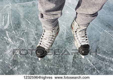 High angle view and close-up of hockey skates on ice; Calgary, Alberta, Canada View Large Photo Image Stock Photograph - High angle view and close-up of hockey skates on ice; Calgary, Alberta, Canada. Fotosearch
