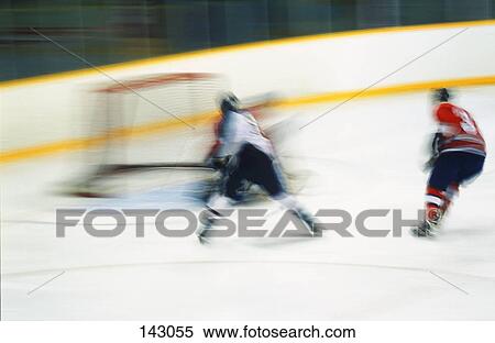 Stock Photography - Hockey player scoring. Fotosearch
