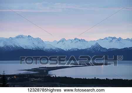 Stock Photograph - Homer Spit and the Kenai Mountains; Homer, Alaska, United States of America. Fotosearch