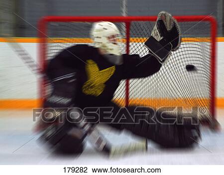 Stock Image - Ice hockey goalie missing save. Fotosearch