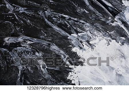 Stock Photograph - Ice on the tidal flats of Kachemak Bay; Alaska, United States of America. Fotosearch
