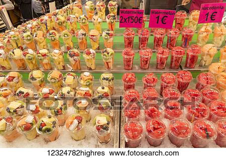 Stock Photograph - Juice shop in Boqueria Market, one of the most famous markets around Spain and the most famous in Barcelona; Barcelona, Catalonia, Spain. Fotosearch