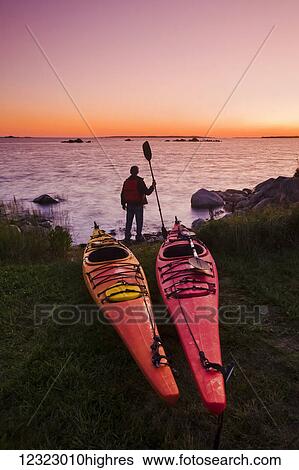 Kayaks along Atlantic Ocean coastline, Bear Point; Nova Scotia, Canada View Large Photo Image Stock Photograph - Kayaks along Atlantic Ocean coastline, Bear Point; Nova Scotia, Canada. Fotosearch